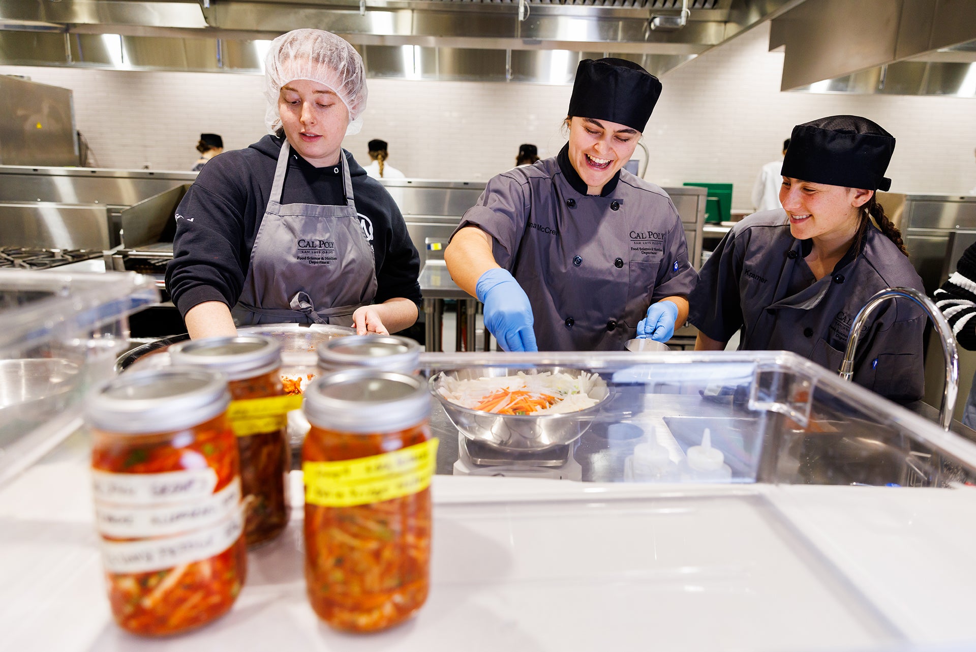 Students in Contemporary Issues in Food Choice and Preparation, prepare kimchi as part of a unit on probiotic and prebiotic foods.