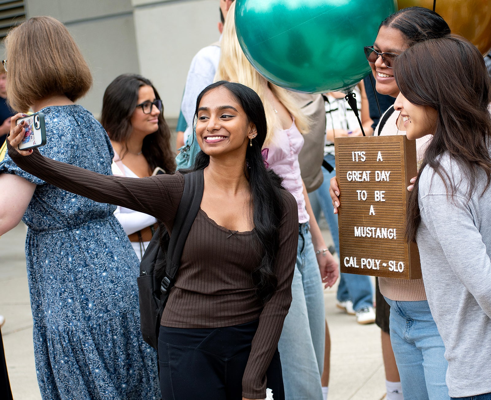 Students take selfies together on the first day of fall quarter 2025. 