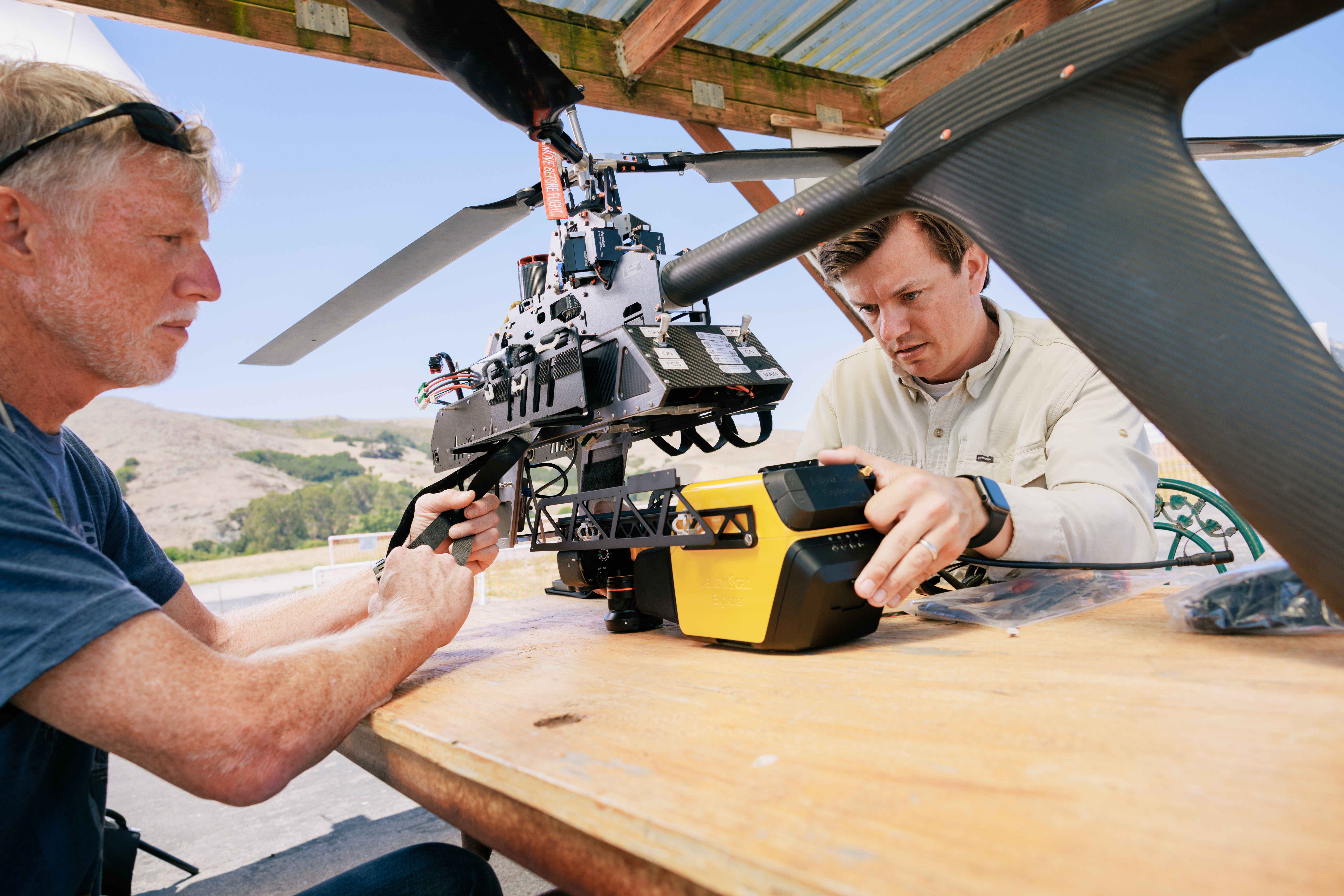 Rangeland Ecology and Management Professor Marc Horney works with a graduate student to take a drone equipped with LIDAR, hyperspectral, and multispectral imagery capture on a test flight.