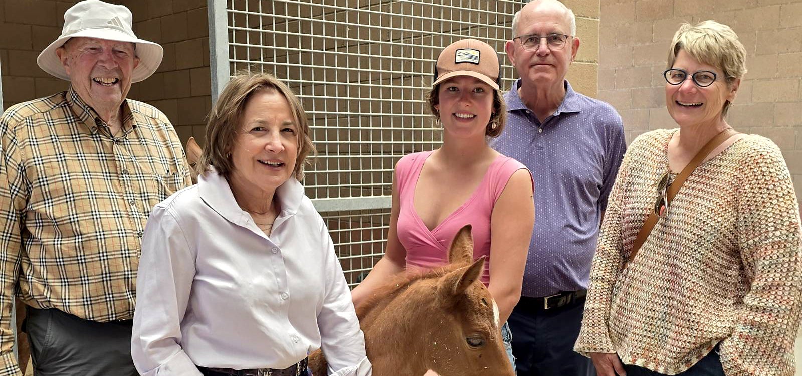 From left to right: Frank Tripiano, Susan Schwabacher, an animal science student,  Tom Scott and Allison Rohnert during a visit to Cal Poly’s Oppenheimer Family Equine Center.