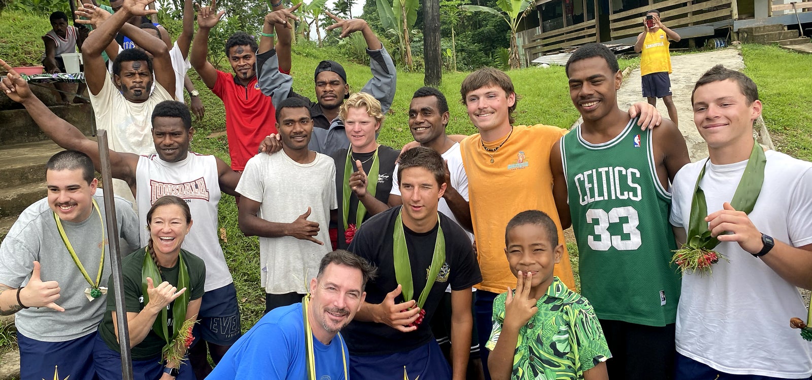 Cal Poly Maritime Academy students pose for a photo with Fijians.