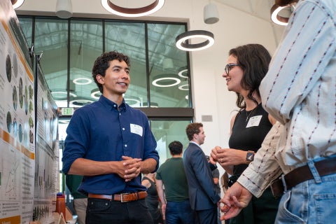 A Cal Poly student presents his findings during the Summer Undergraduate Research Program final.