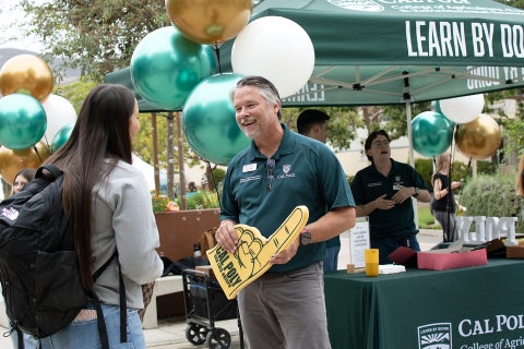 The College of Agriculture, Food and Environmental Sciences Dean Brian Horgan talks with students on the first day of class. 