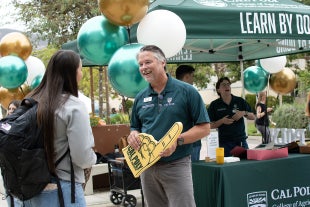 The College of Agriculture, Food and Environmental Sciences Dean Brian Horgan talks with students on the first day of class. 