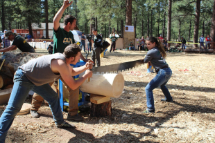 Cal Poly students compete in the double buck event during a logging competition. 
