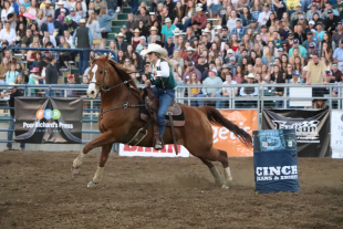 A Cal Poly student competes in the barrel racing event. 