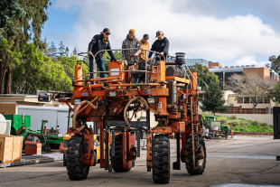 Cal Poly College of Agriculture, Food and Environmental Sciences students work on an agave harvester.