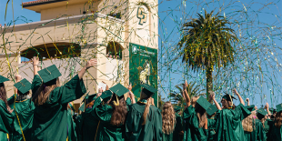 Cal Poly CAFES students cheering as they graduate with confetti surrounds them in the air. 
