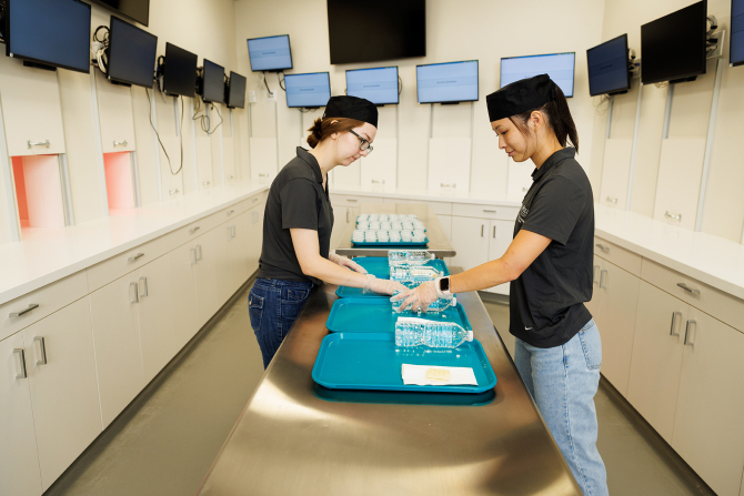 Food science students conduct sensory testing in the sensory analysis teaching and research lab.