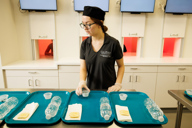 A student prepares a study in the Sensory Analysis Teaching and Research Lab.