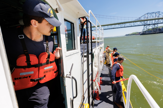 Cadets perform a Man Overboard drill aboard the Cub training vessel.