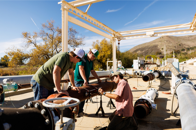 Students within the BioResource and Agricultural Engineering Department working on irrigation research at Cal Poly