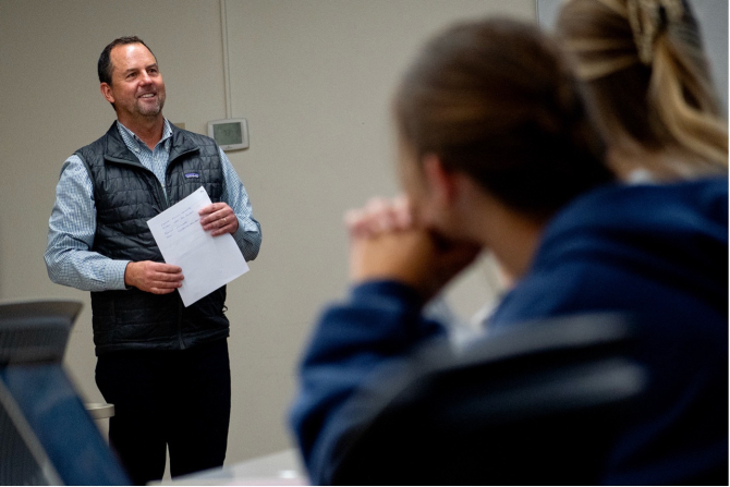Students in Agricultural Business 2202 listen to Lecturer Doug Sawyer introduce a panel of presenters.