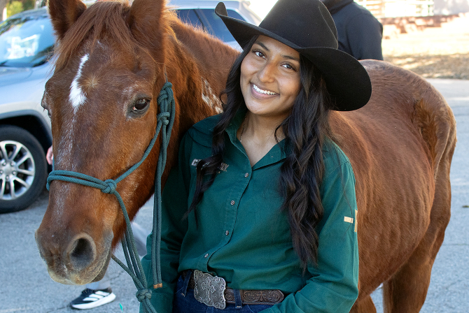 A Cal Poly student with Chase, the university mascot. 