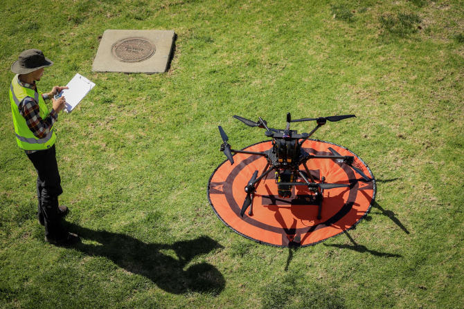 A Cal Poly student uses a drone as part of the Geospatial Systems Lab at Cal Poly.