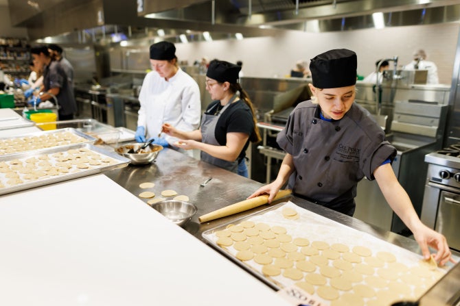 Students in Food Service Operations course prepare items for Taste of the World, a partnership with Cal Poly’s International Center, that provides the campus community with a unique opportunity to savor international flavors. 