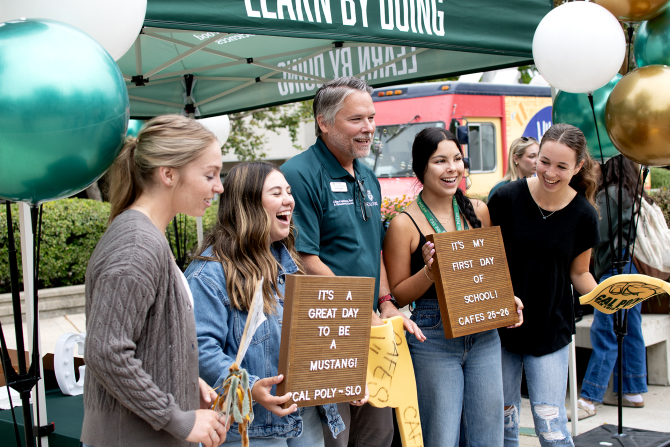 A group of College of Agriculture, Food and Environmental Sciences Ambassadors pose for a photo with the dean. 