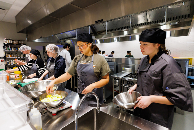 Students prepare kimchi as part of a unit on probiotic and prebiotic foods.