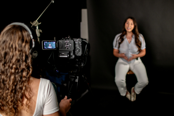Students film an interview in the Digital Video and Social Media Engagement Lab. 