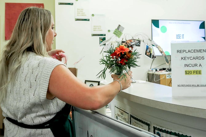 A College of Agriculture, Food and Environmental Sciences floral design student delivers a bouquet
