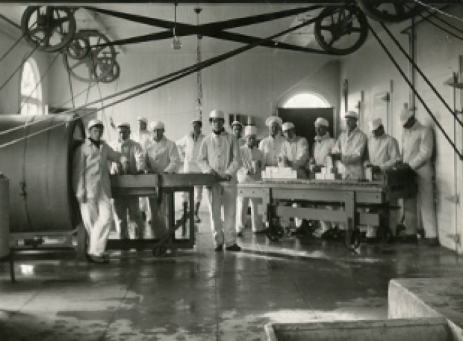 Students packaging butter in the Creamery, circa 1910. Photo attributed to Frank Aston. Courtesy University Archives.