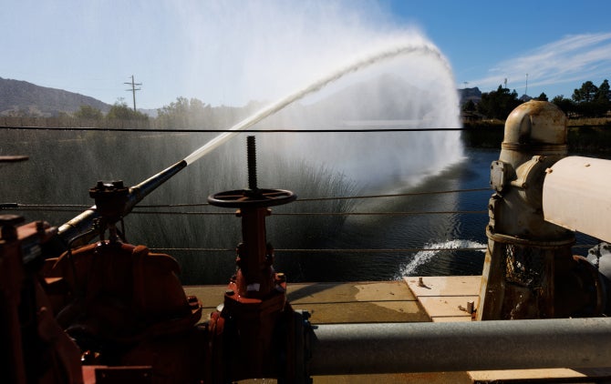 A water cannon irrigates the Merriam Irrigation Practices Field.