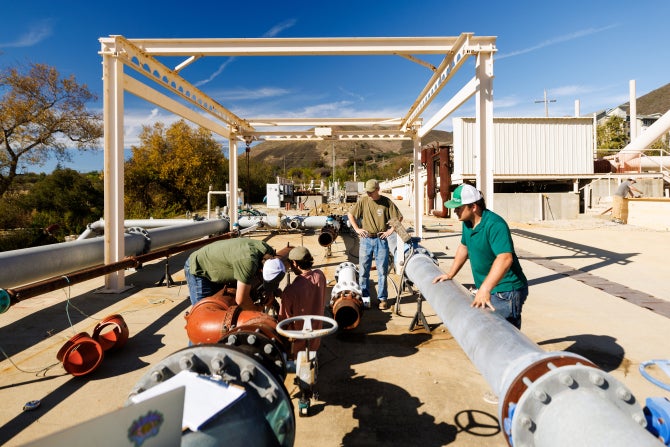 Students work on pipes at the Merriam Irrigation Practices Field which is used for instruction in BRAE irrigation classes.