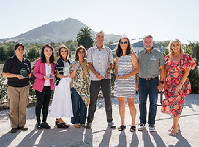 Staff and faculty from the College of Agriculture, Food and Environmental Sciences pose for a photo following the faculty and staff awards banquet. 