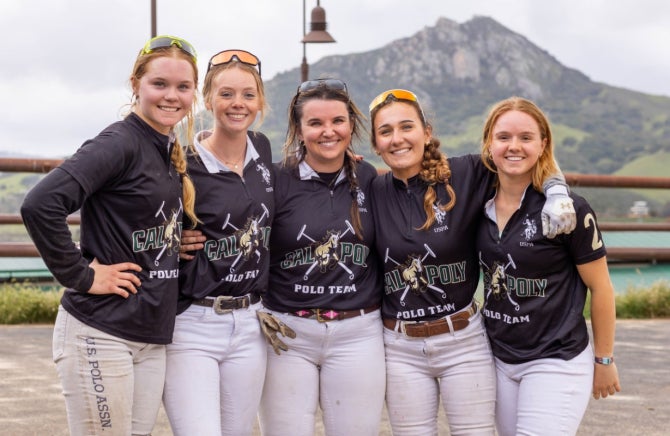 Five members of the Cal Poly Polo Team pose for a photo with their arms around their teammates shoulders. 
