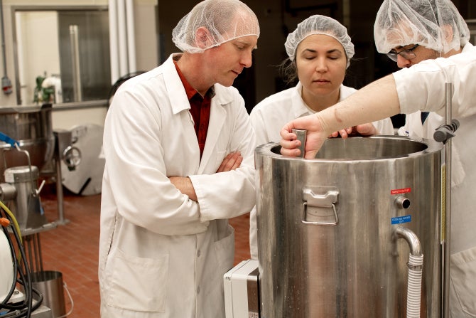 Students perform research with Dairy Products Technology Center staff. 