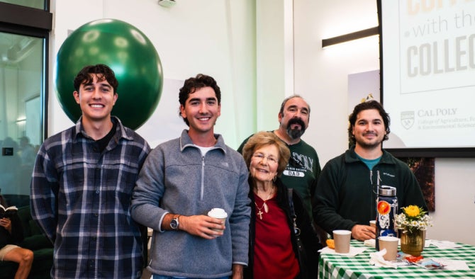 Parents with their students pose for a photo at Coffee with the College.